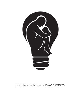 Silhouette of person inside of a lightbulb shape
