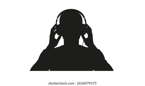 Silhouette of a person listening to music with large headphones looking straight ahead