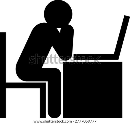 Silhouette of a person looking dejected while looking at a laptop (side view)