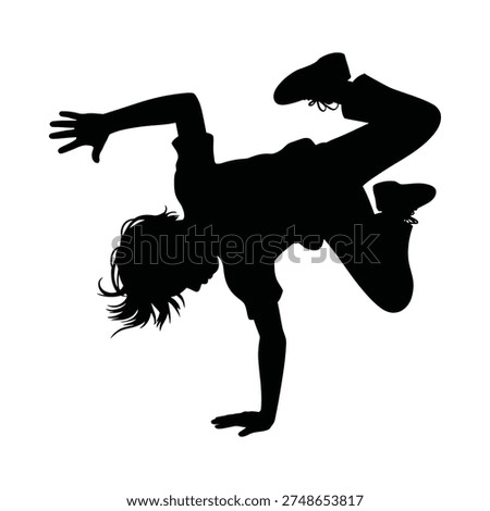 Silhouette of a person performing a dynamic handstand breakdance move
