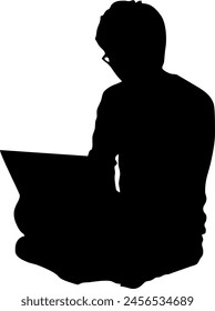 The silhouette of a person is sitting and opening his laptop