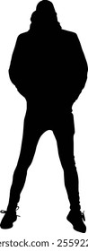 Silhouette of a person standing confidently with a hoodie and hands in pockets.