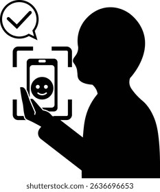 Silhouette of a person using face recognition on a smartphone