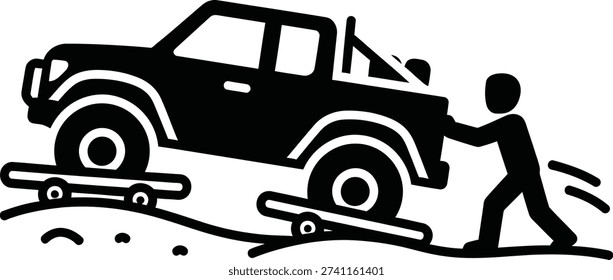 Silhouette Person using tow straps to recover stuck vehicle on flatbed