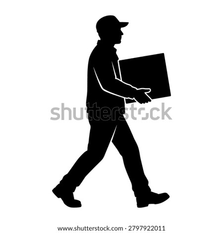 Silhouette of a person walking while carrying a box or package.