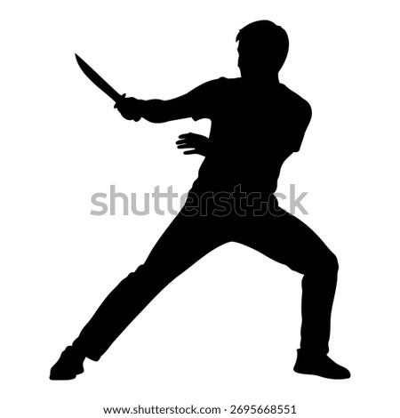 Silhouette of person wielding a knife with an aggressive stance