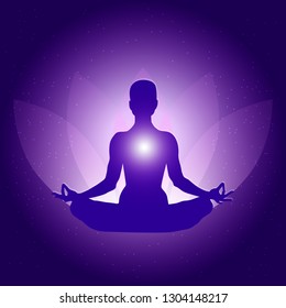 Silhouette of Person in yoga lotus asana on dark blue purple background with lotus flower and light