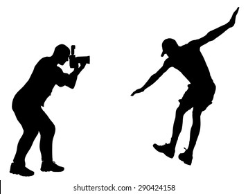 Silhouette photographer at work with action athlete.