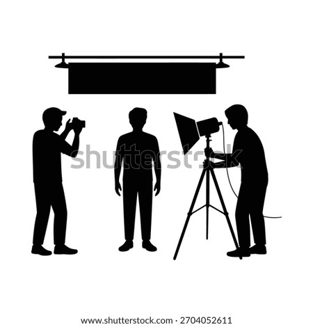 Silhouette of a photography studio setup with a model and crew