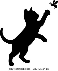 Silhouette of a playful kitten reaching for a buzzing bee