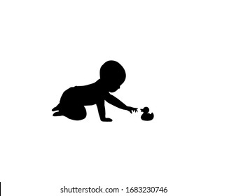 A silhouette of playing baby with toy on white background. Toddler crawling on the floor. A small child stretches his hand to toy duckling.
