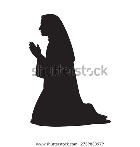Silhouette of a praying nun in a kneeling position religious devotion shown