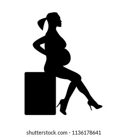 Silhouette of a pregnant girl sitting on a black pedestal on a white background, vector