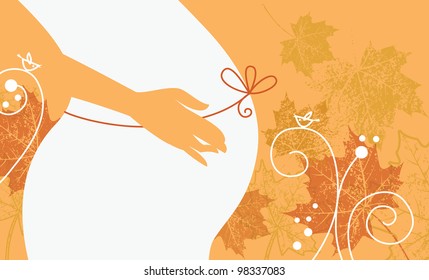 Silhouette of pregnant woman in autumn