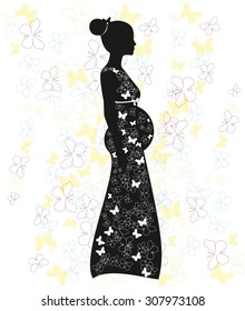 Silhouette of pregnant woman with butterflies.