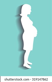 Silhouette of the pregnant woman, cut from paper. Vector illustration.