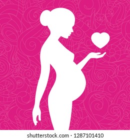 Silhouette of pregnant woman with floral ornament and heart