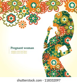 Silhouette of pregnant woman with flowers