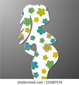 silhouette of a pregnant woman with flowers