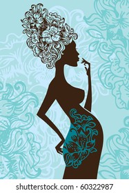 Silhouette of pregnant woman in flowers