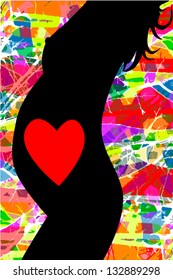 silhouette of a pregnant woman with a heart