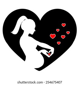 Silhouette of Pregnant woman holding her hands in a heart shape. 