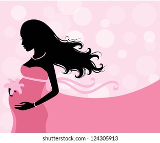 Silhouette of a pregnant woman on the pink background.