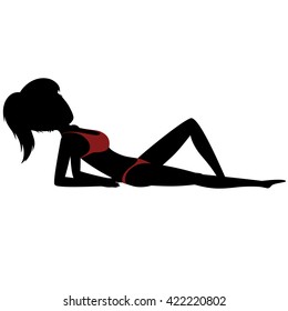 Silhouette of a pretty girl is sunbathing (in red swimsuit)