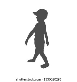 Silhouette in profile of a boy. The child is wearing a t-shirt and breeches, both hands down.