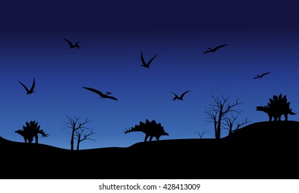 Silhouette of Pterodactyl and Stegosaurus at the night