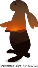  Silhouette of  rabbit with desert landscape.