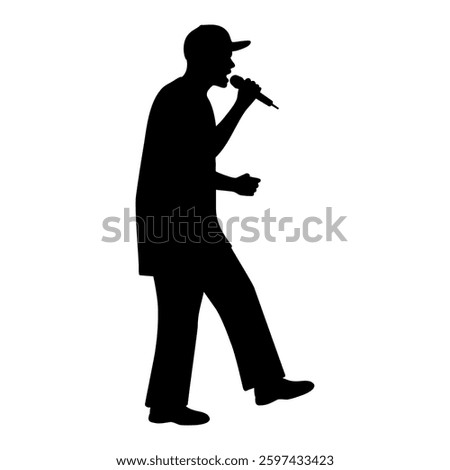 Silhouette of rap singer with baseball cap performing with microphone