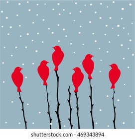 Silhouette red birds on branches in winter.
