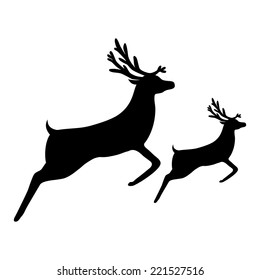 silhouette of a reindeer with a cub