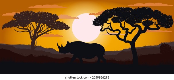 Silhouette of a rhinoceros of the African savannah. Landscape. Wild nature..