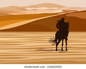 Silhouette of a rider on a horse in the dunes of the desert.