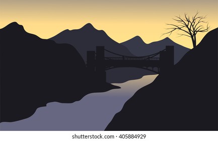 Silhouette of river with black background and bridge
