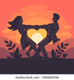 Silhouette of a romantic young couple holding hands and spinning around, forming a heart shape in the sunset