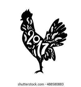 Silhouette of a rooster with lettering year 2017. Christmas elements for your design