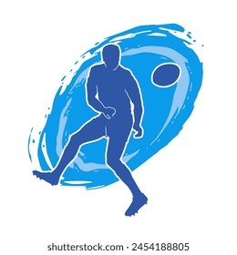 Silhouette of a rugby sport athlete in action. Silhouette of a sporty man playing rugby sport.