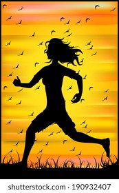 Silhouette of a running athlete at sunset and a flock of birds