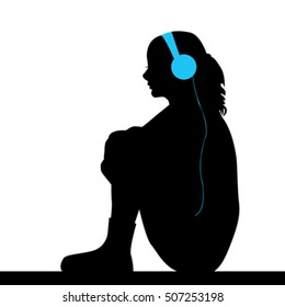 Silhouette of sad girl listening music
