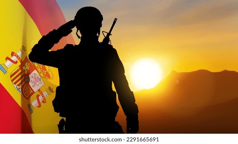 Silhouette of a saluting soldier with Spain flag against the sunset. EPS10 vector