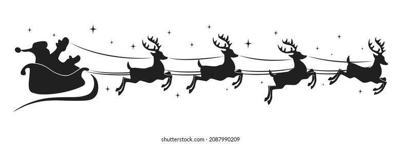 Silhouette of santa claus riding on reindeer sleigh