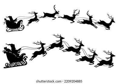 Silhouette of Santa Claus riding sleigh 