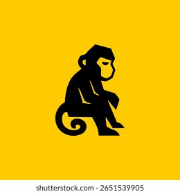Silhouette of a seated monkey on a yellow background