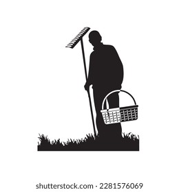 Silhouette einer Leiche mit Rake und Korb auf einem Feld