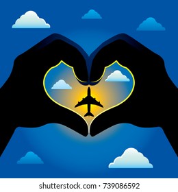 Silhouette Shadow of Two Hands Creating a Heart Shape Image with a Airplane as the Focus representing Love for Travel and Adventure