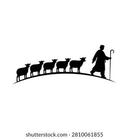 Silhouette of a shepherd walking with a flock of sheep on a hill pastoral scene