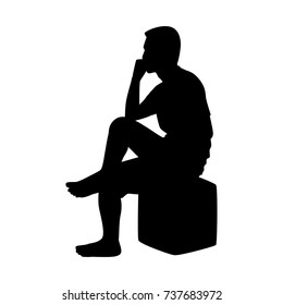 Silhouette of sitting man on white
